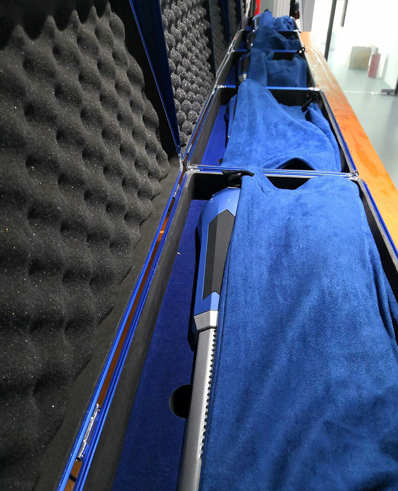 Close-up of a blue car interior with foam padding and a metal tool.