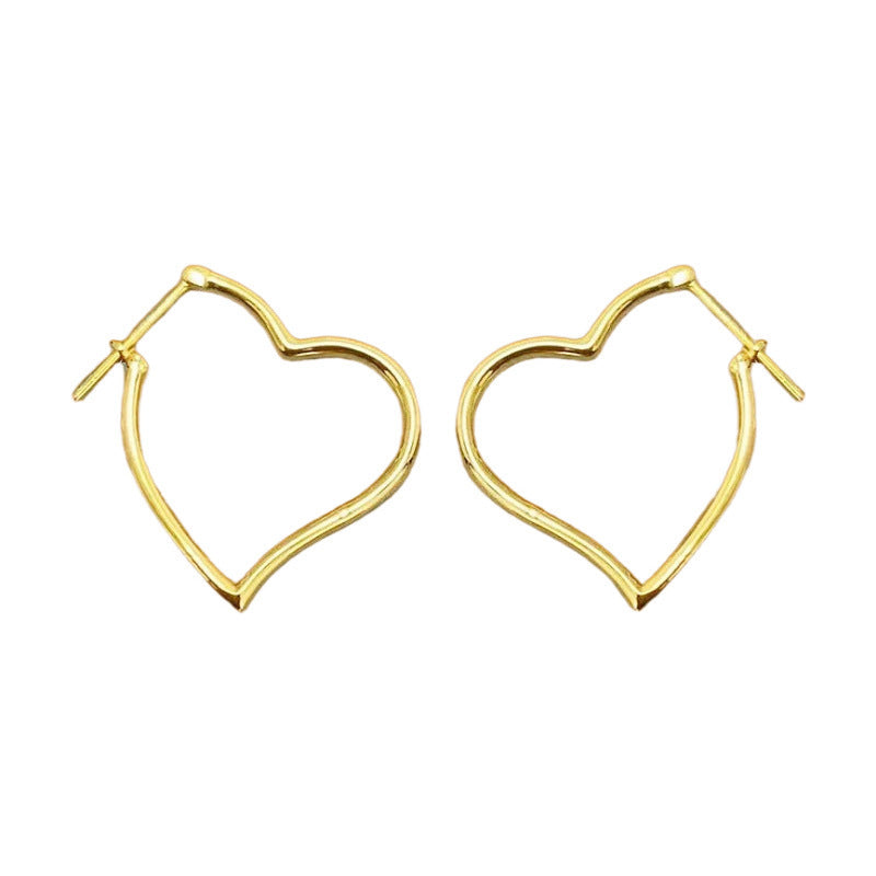 Gold heart-shaped hoop earrings on a white background