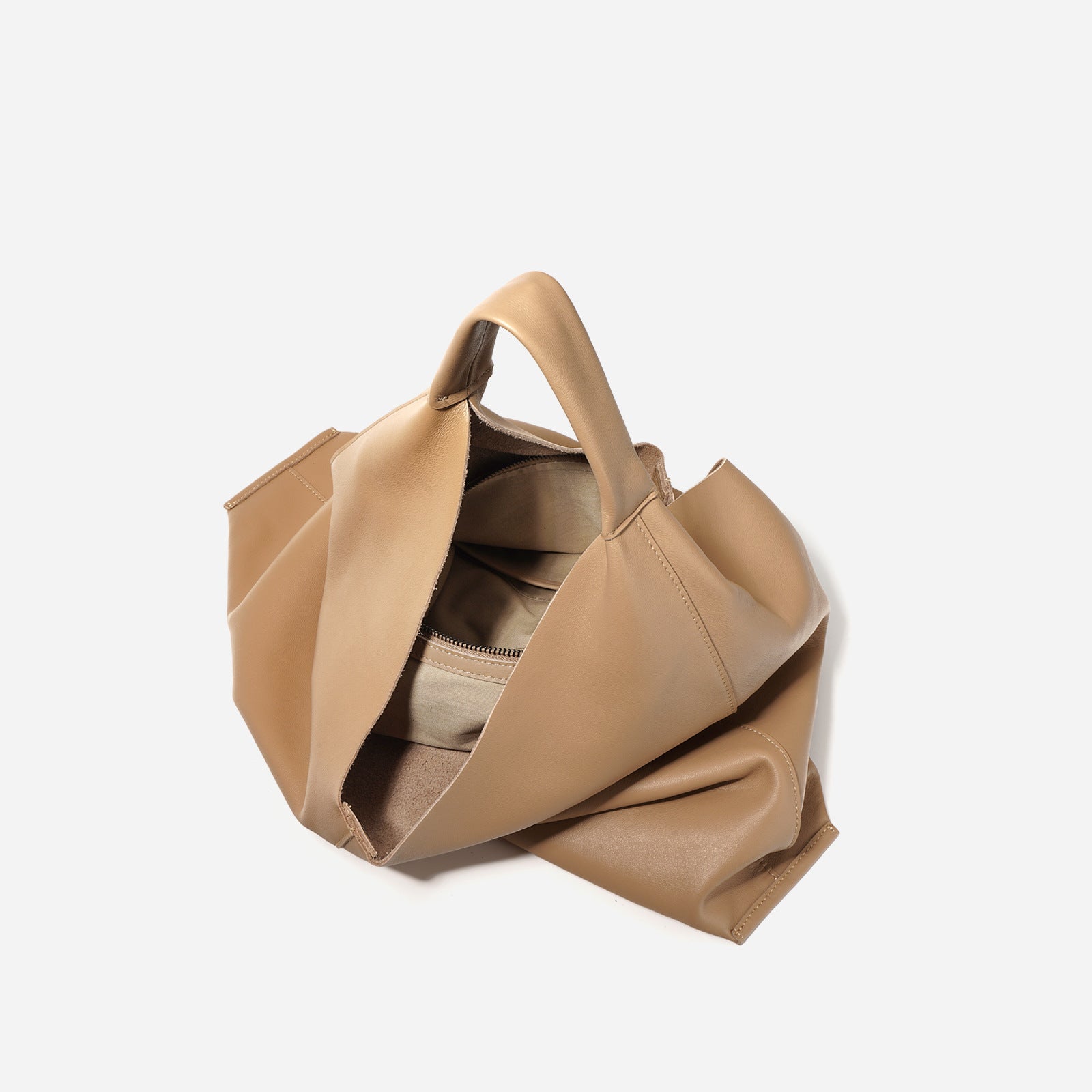 Beige handbag on a white background