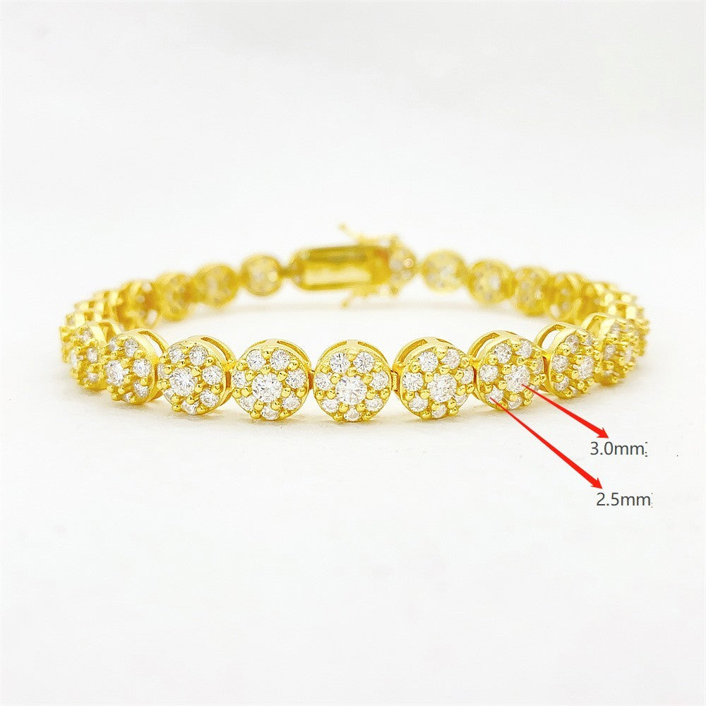 Gold bracelet with diamond accents on a white background