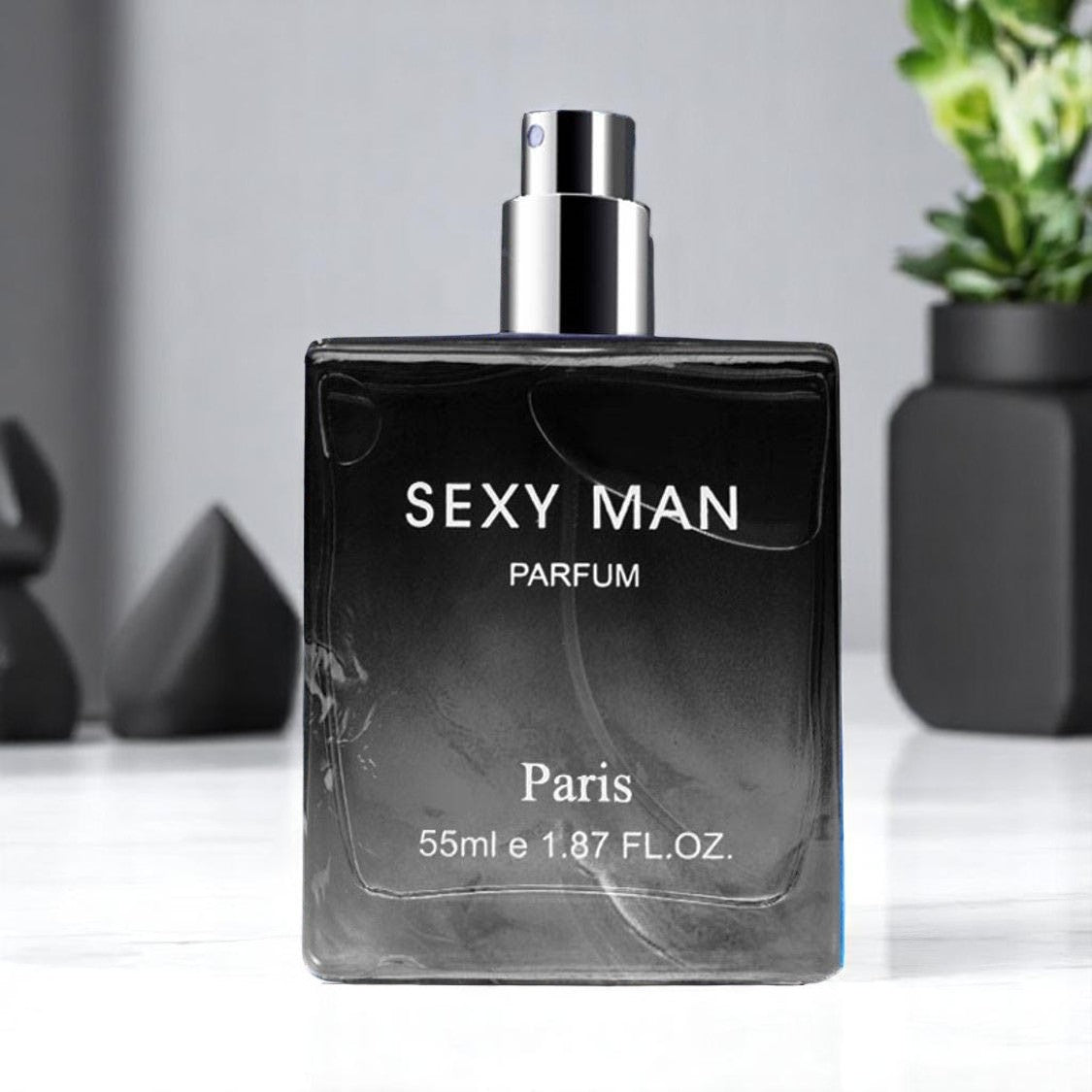 Perfume bottle labeled 'Sexy Man Parfum Paris' on a white surface with a gray background.
