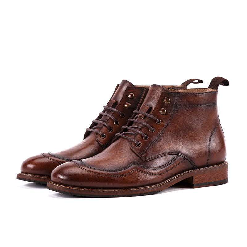 Pair of brown leather boots on a white background