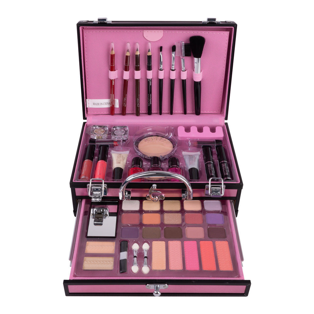 Makeup set with various products in a pink case on a white background