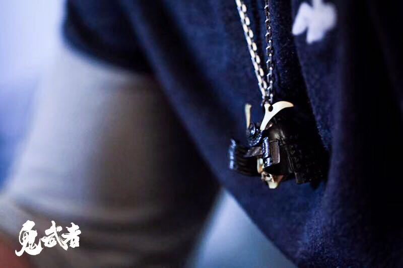 Close-up of a necklace with a pendant on a blurred background