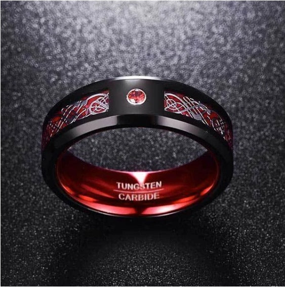 Tungsten carbide ring with red interior and black exterior on a dark textured background