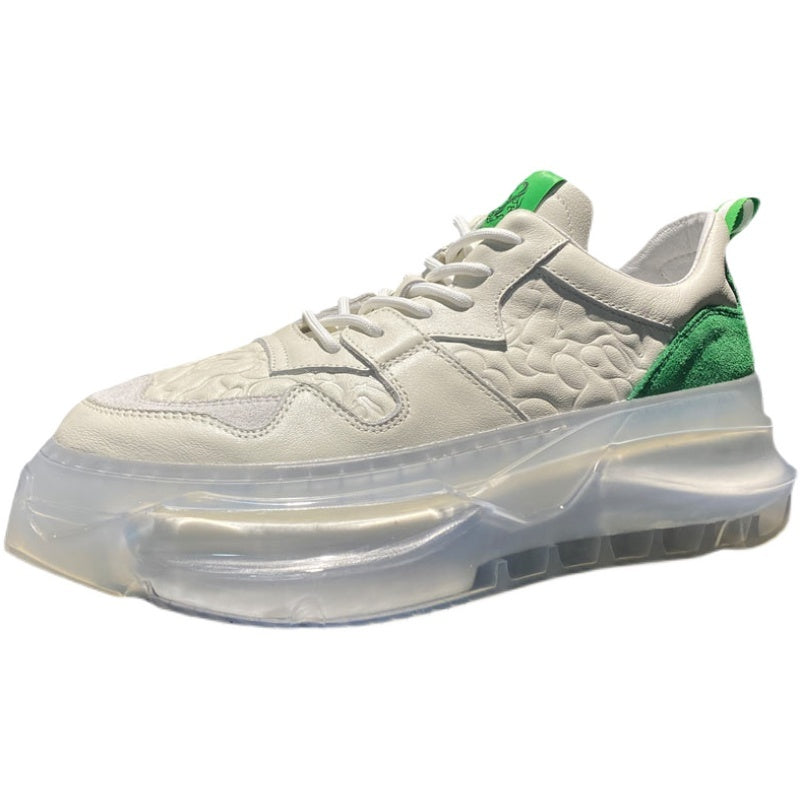 White sneaker with green accents on a white background