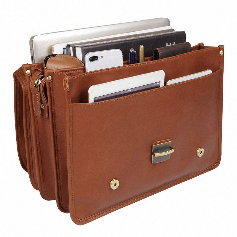 Brown leather organizer with compartments for electronic devices on a white background