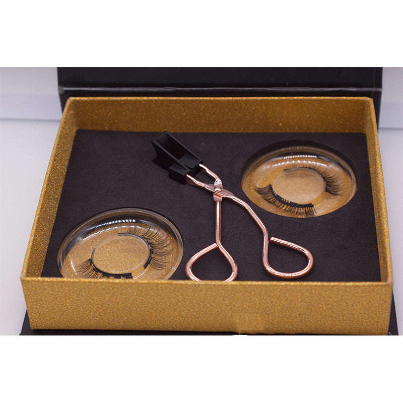 Eyelash set with tweezers in a gold box on a white background