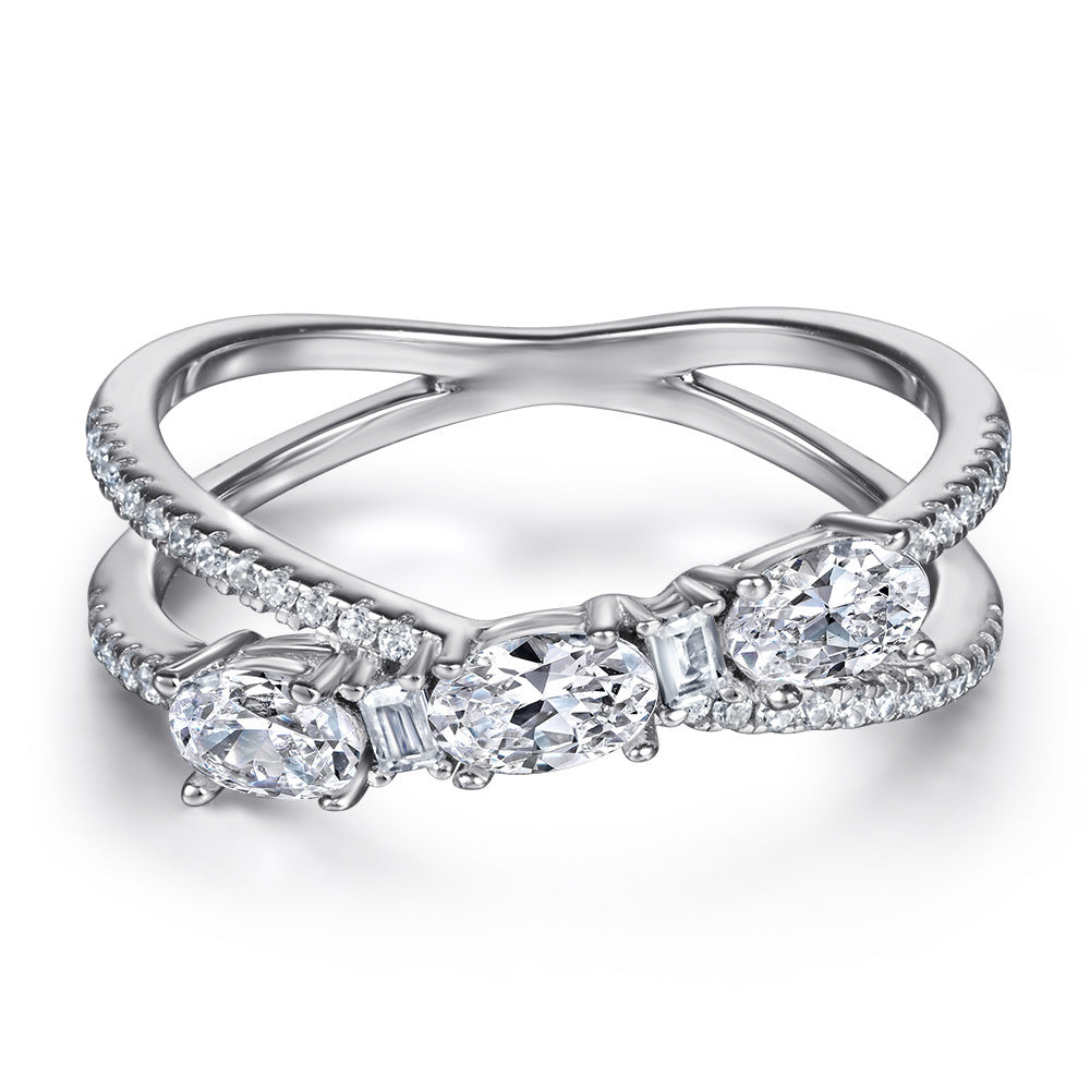 Silver ring with diamond stones on a white background