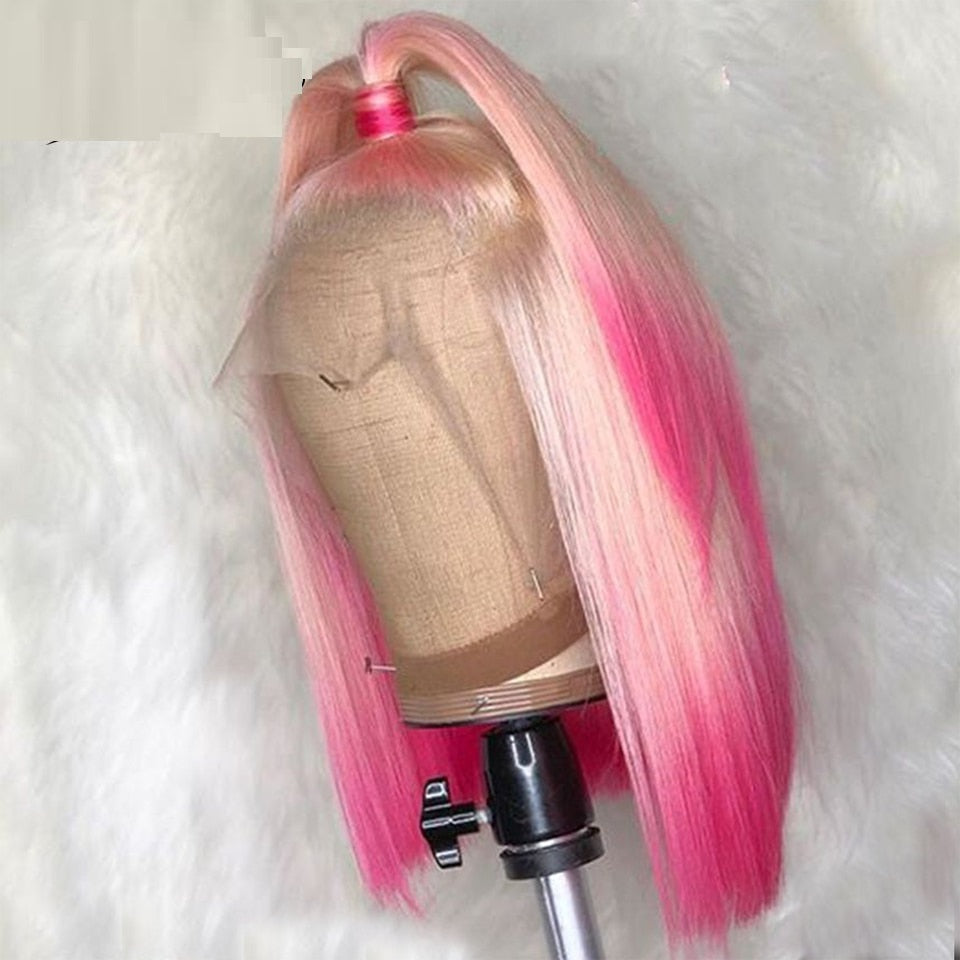 Mannequin head with pink and blonde ombre wig on a white background