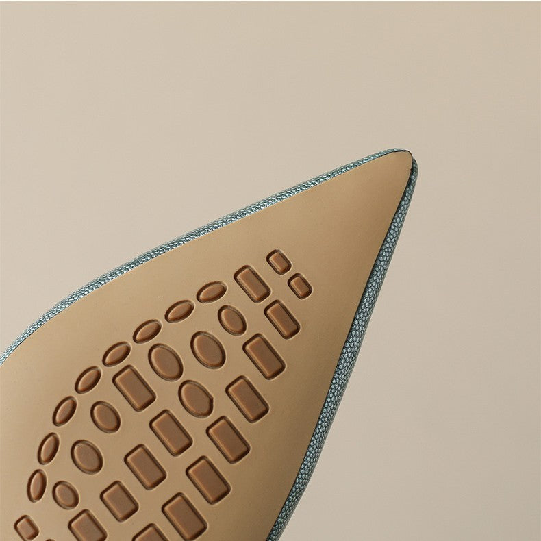 Tan shoe sole with textured pattern on a beige background