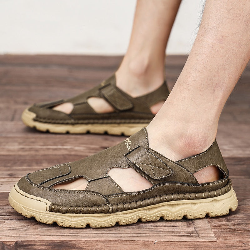 Brown sandals worn on a wooden floor