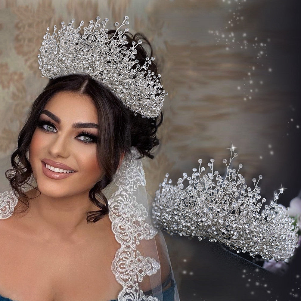 Woman wearing a sparkling tiara with a soft, blurred background