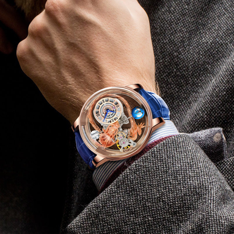 Luxury watch with detailed design on a person's wrist, wearing a gray suit.