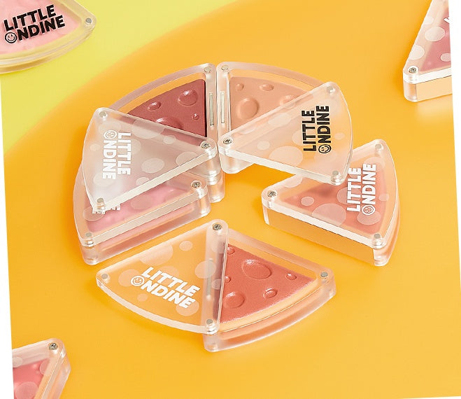 Triangular blush compact with 'LITTLE ONDINE' branding on a yellow background