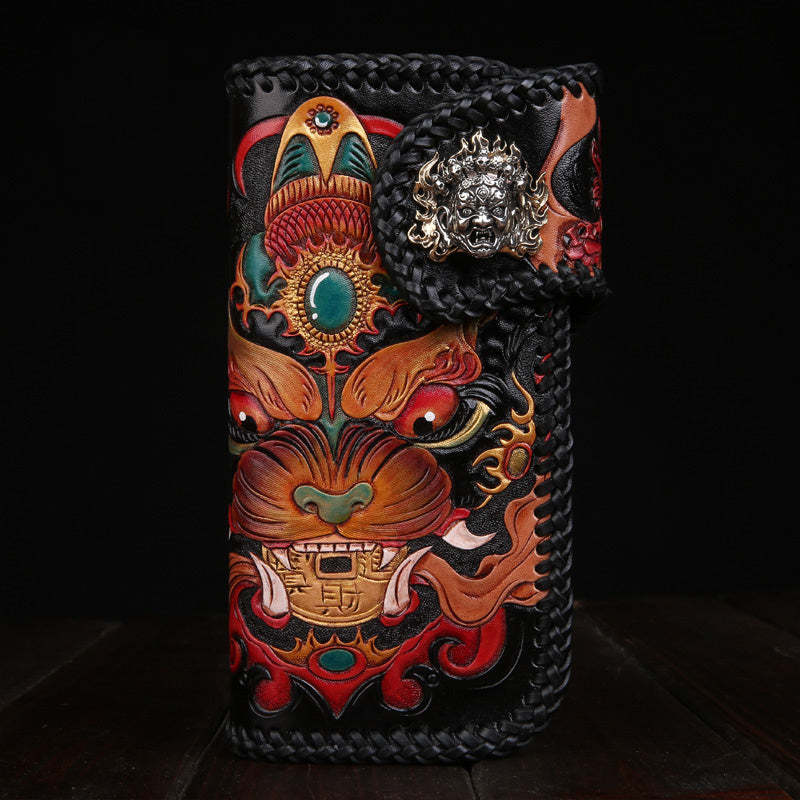 Decorative leather pouch with intricate designs and patterns on a dark background