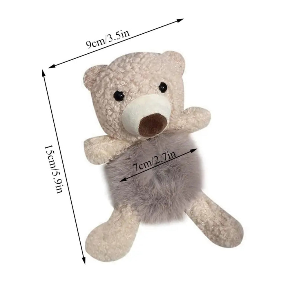 Small teddy bear with dimensions labeled on a white background