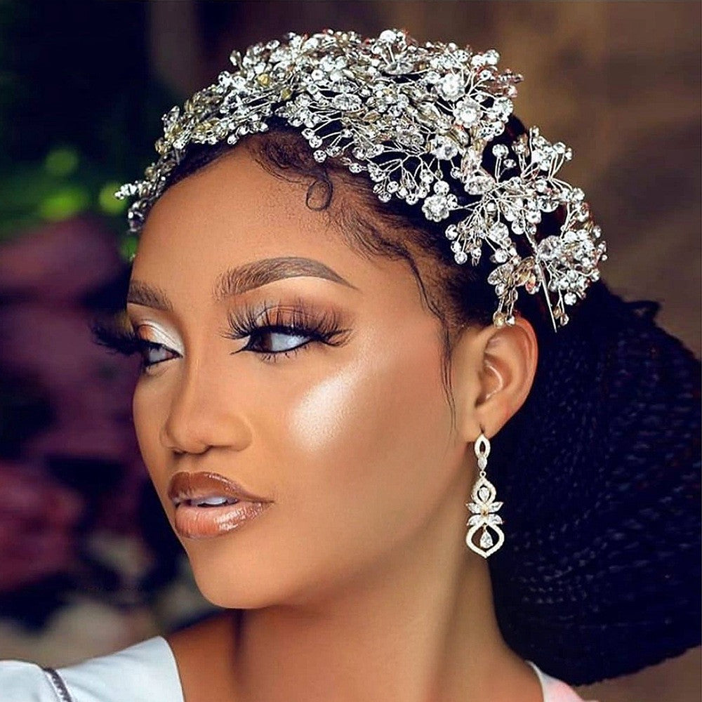 Woman wearing a decorative headpiece with intricate details