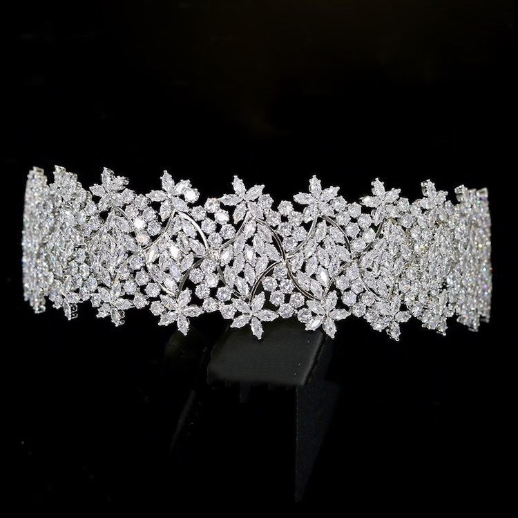 Silver tiara with floral design on a black background
