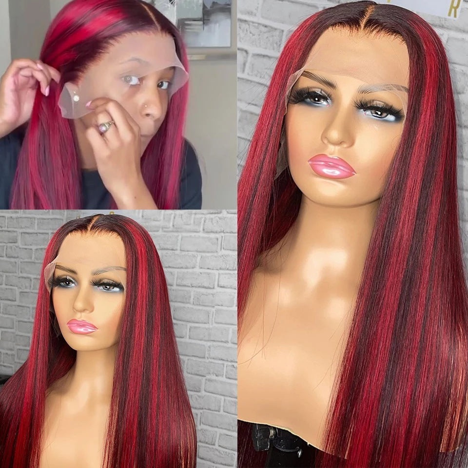 Red and black wig on a mannequin head with close-up of hairline.
