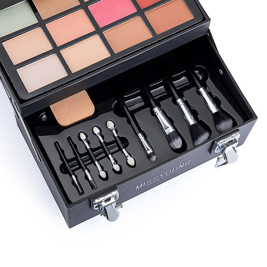Makeup palette with brushes in a black case on a white background