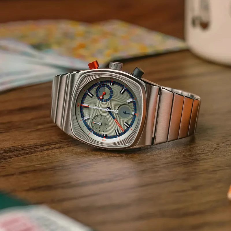 Luxury watch with a detailed face on a wooden surface