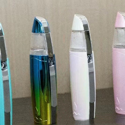 Four electronic devices with different colored casings on a reflective surface.