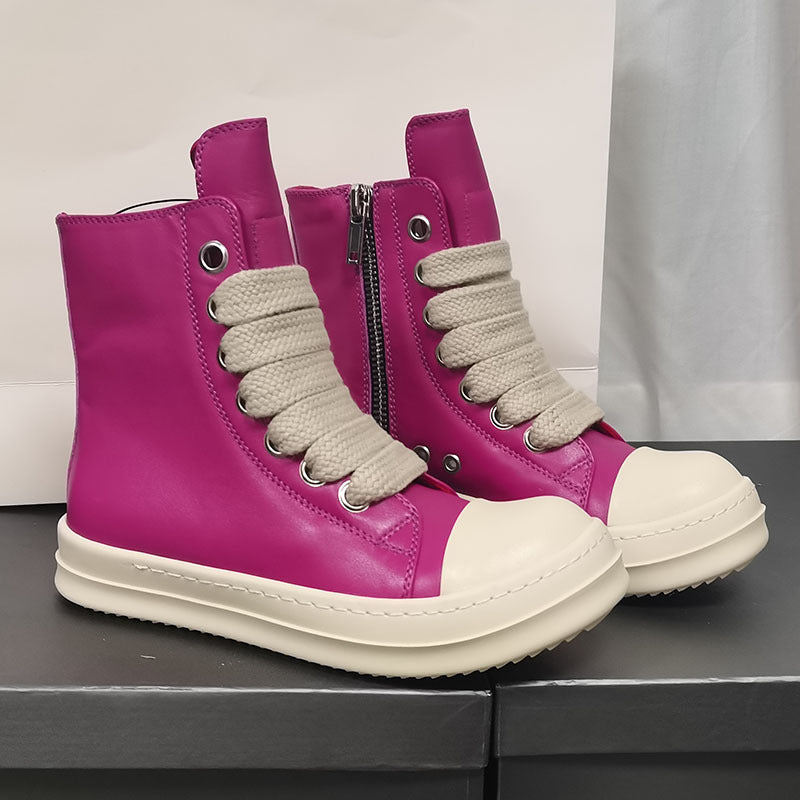 Pair of pink high-top sneakers with white soles on a black surface.
