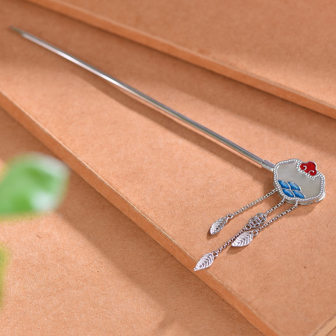Decorative hairpin with floral design on a brown surface