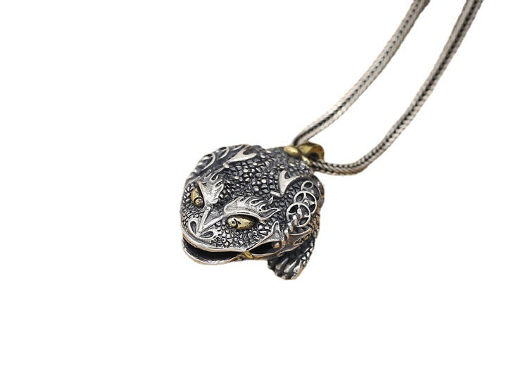 Silver panther pendant necklace on a white background