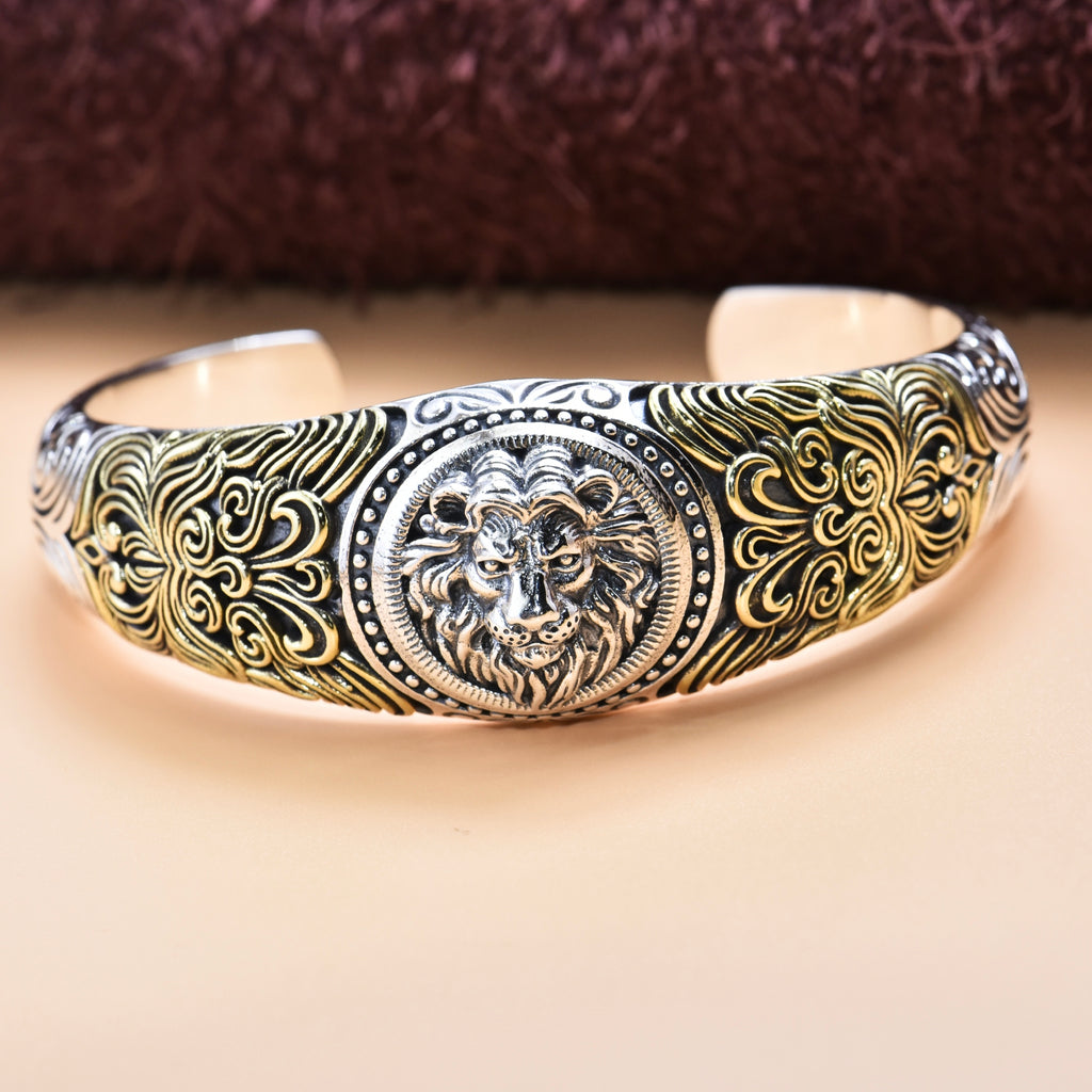 Decorative bracelet with lion emblem on a beige background