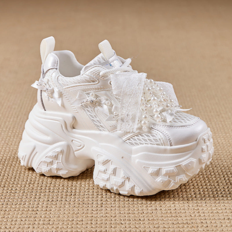 White textured sneaker on a beige background