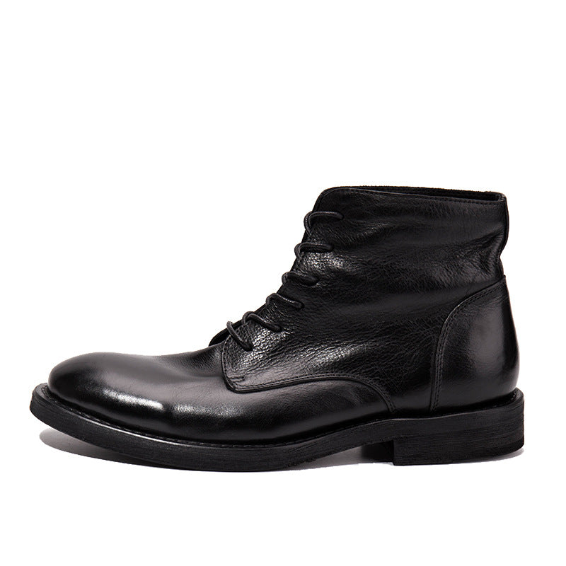 Black leather boot on a white background