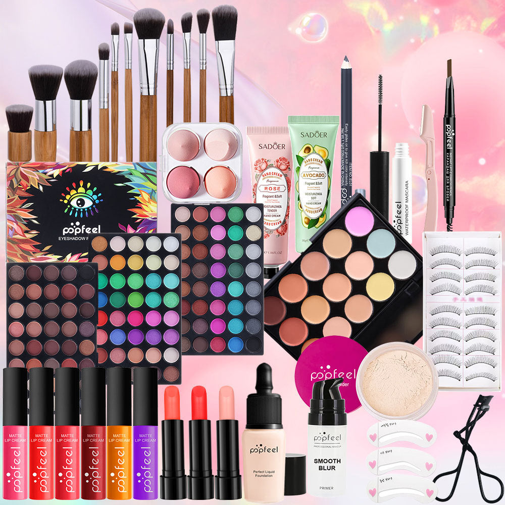 Assorted makeup products including brushes, palettes, and lip products on a pink background