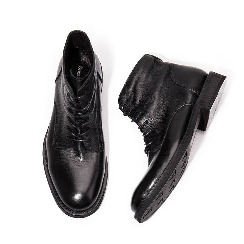 Black leather boots on a white background