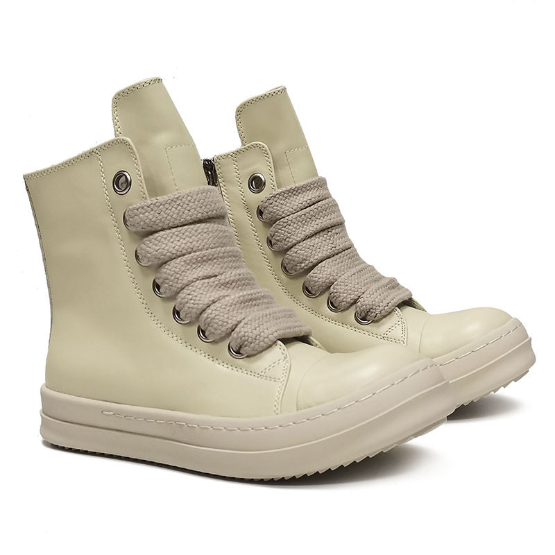 Pair of beige high-top sneakers with braided laces on a white background