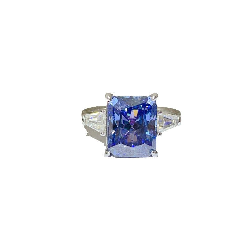 Ring with a blue gemstone on a white background