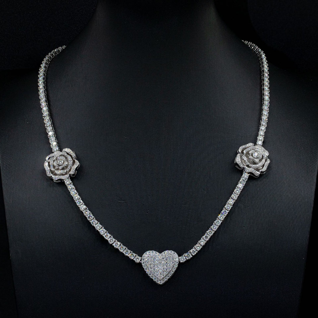 Diamond necklace with rose and heart designs on a black background
