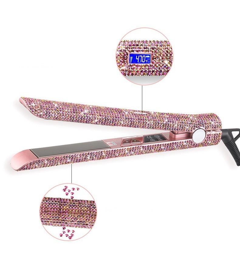 Pink hair straightener with rhinestone embellishments on a white background