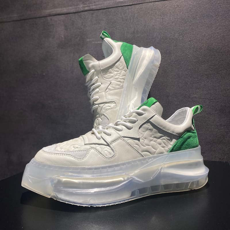 White sneakers with green accents on a dark background