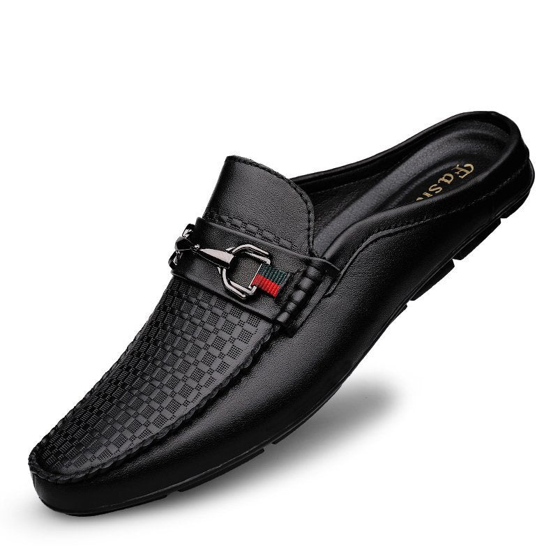 Black loafer shoe with a checkered pattern on a white background