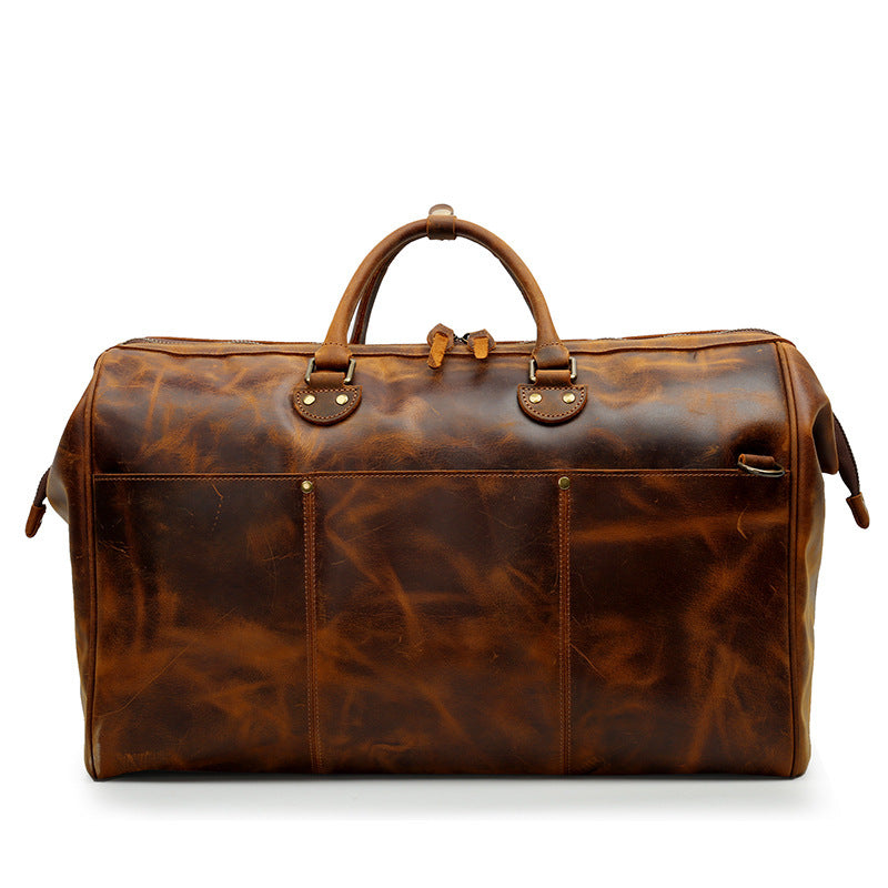 Brown leather duffel bag on a white background
