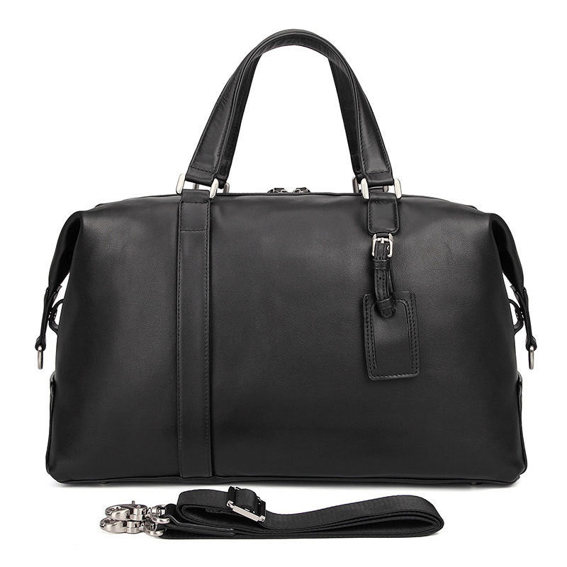 Black leather duffel bag with shoulder strap on a white background
