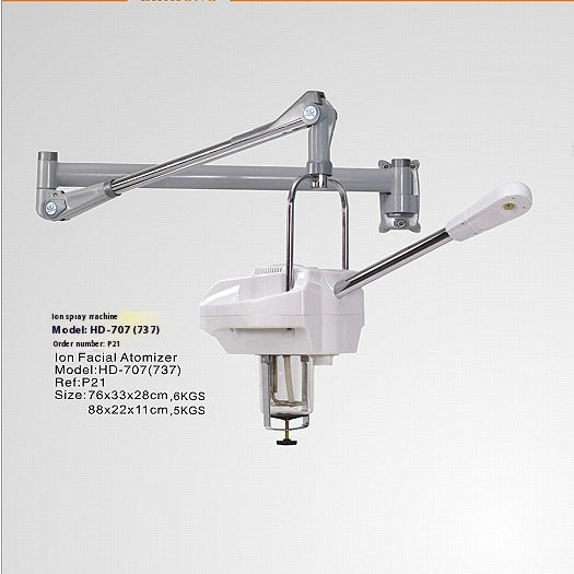 Ion spray machine with arm and nozzle on a light gray background