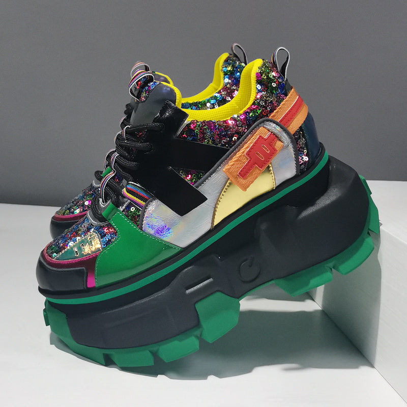 Colorful platform sneakers with sequins on a gray background