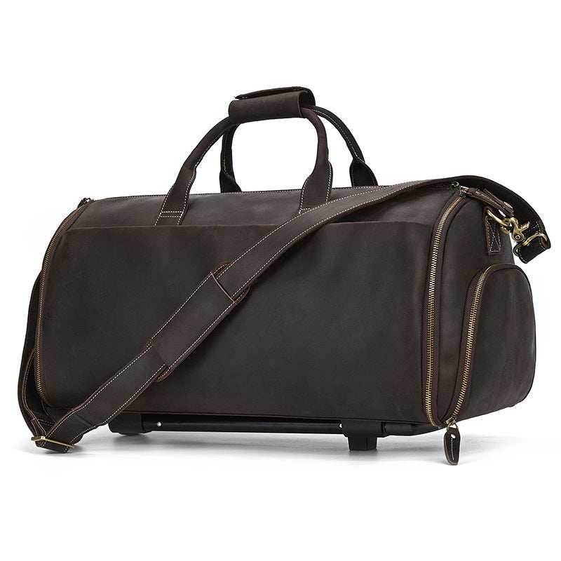 Brown leather duffel bag with wheels on a white background