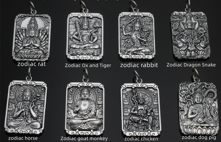 Set of silver zodiac pendants on a black background