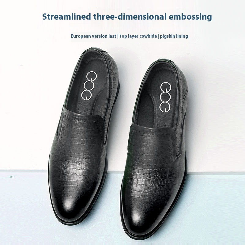 Black leather shoes with embossing on a white background