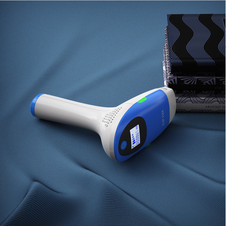 White and blue handheld device on a blue fabric background