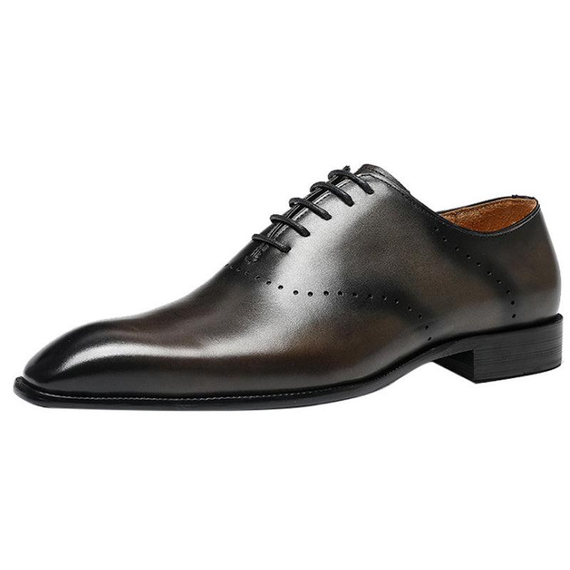 Black leather dress shoe on a white background